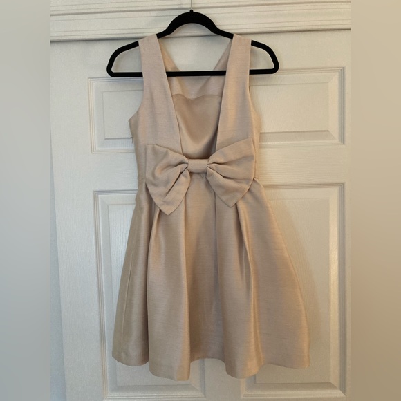 Lulus Dresses & Skirts - Lulus beige color dress with bow in back!